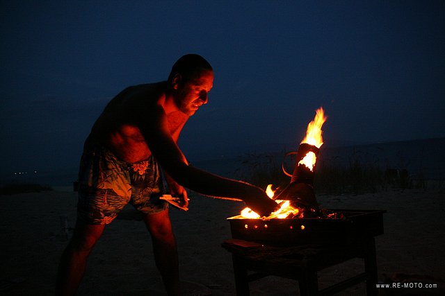 Babis preparing a fire to cook dinner.
