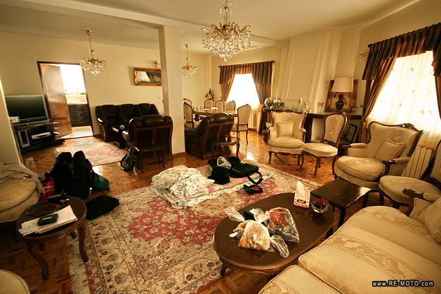 A typical Iranian style house, with many arm chairs and carpets.